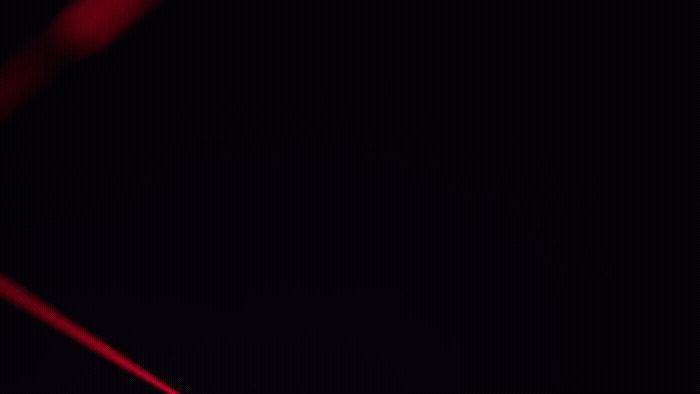 a close up of a red object in the dark