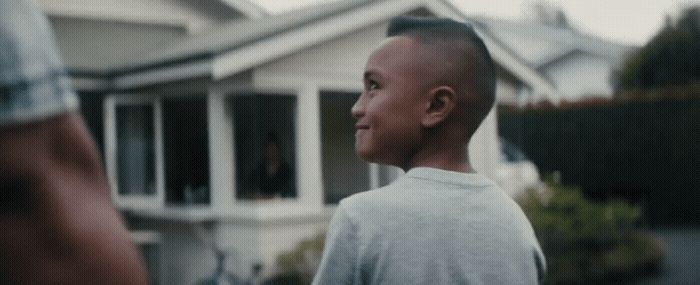 a man standing in front of a house