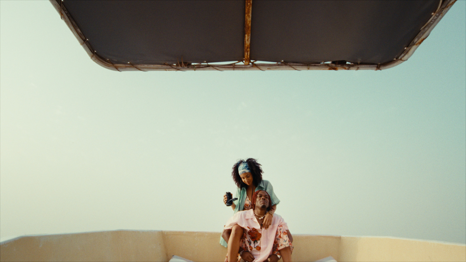 a man and a woman sitting on a boat