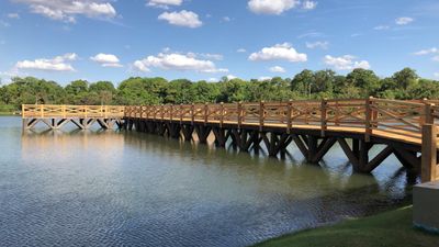 a wooden bridge over a body of water