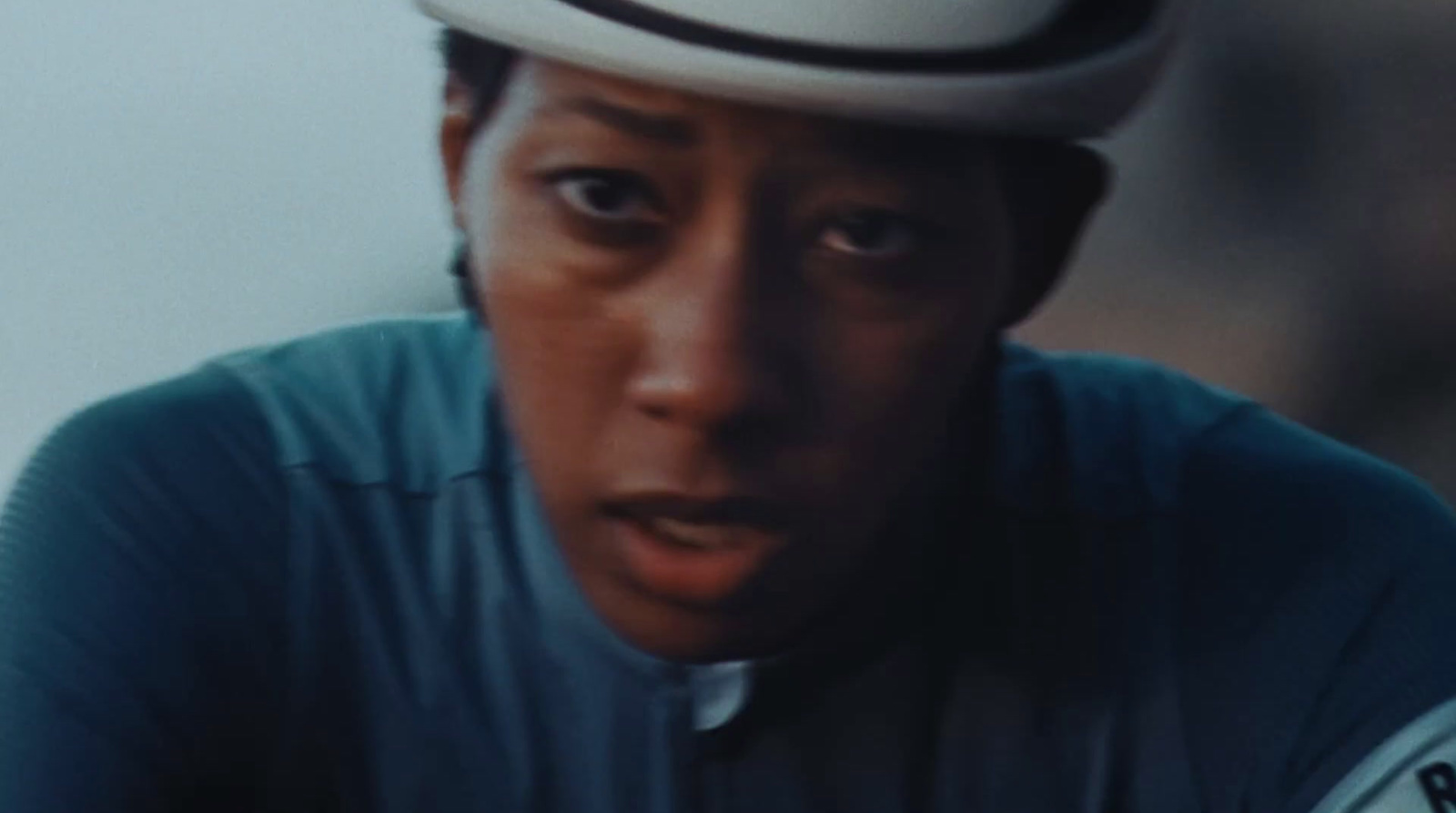 a man wearing a white hat and a blue shirt