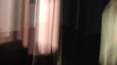 a blurry photo of a person standing in front of a window