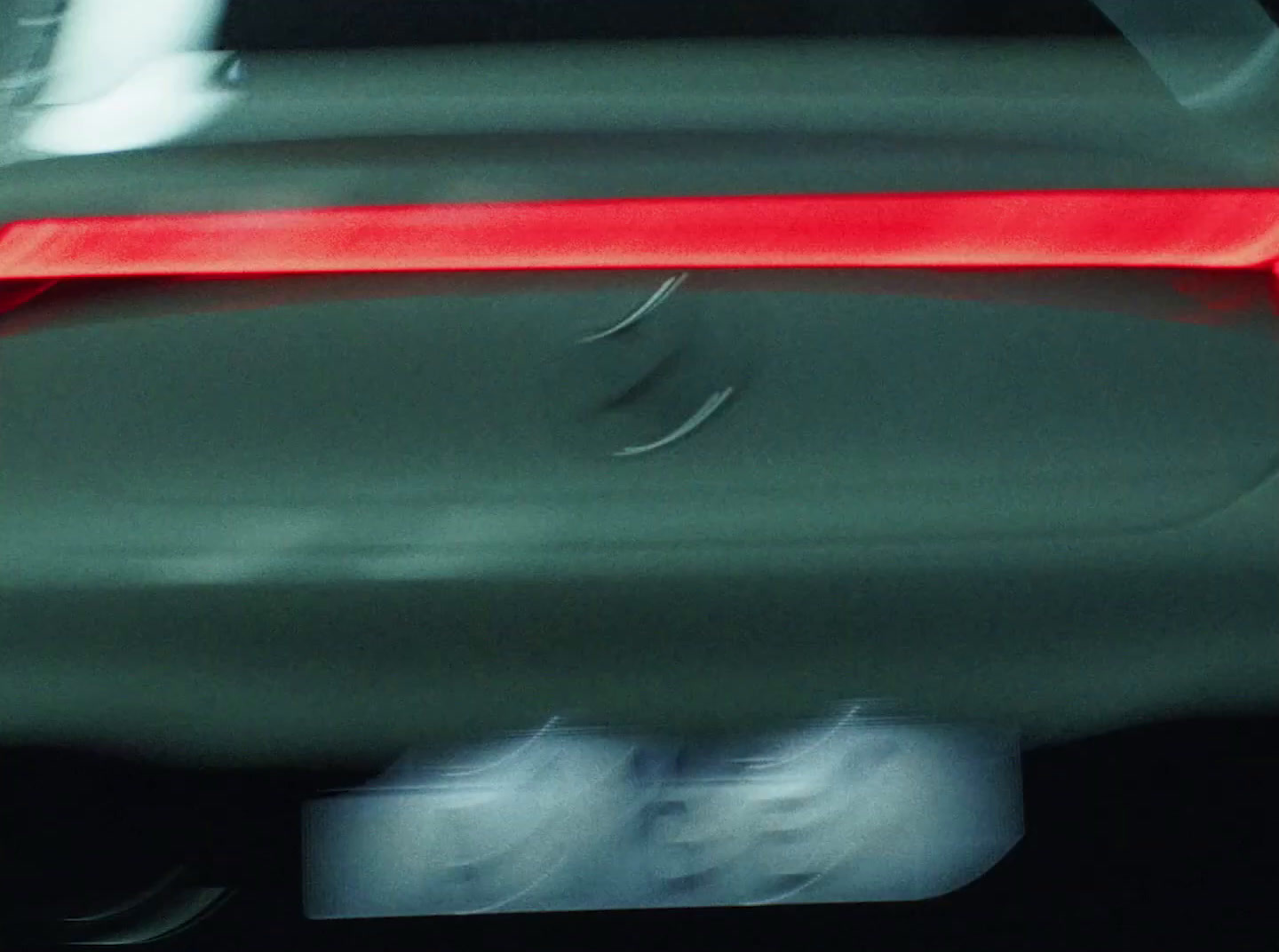 a blurry photo of a car's tail light