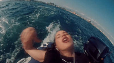 a man riding a jet ski on top of a body of water