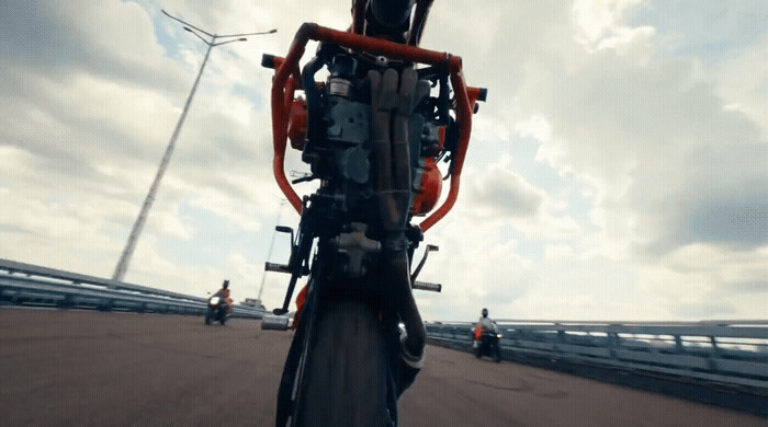 a person riding a bike on a bridge