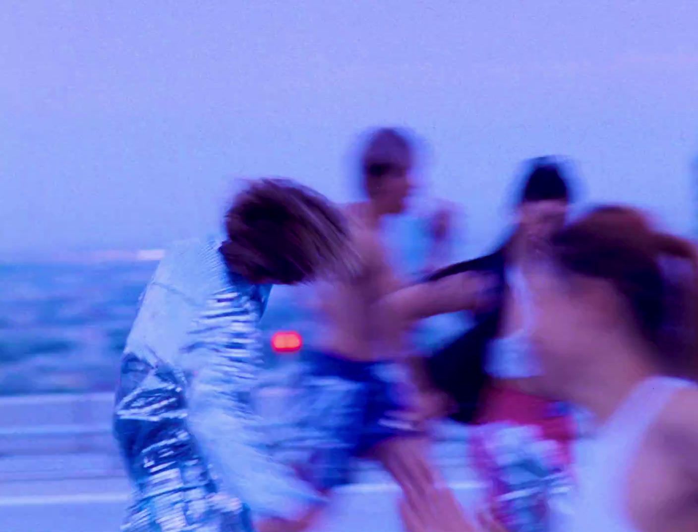 a blurry photo of a group of people on a beach