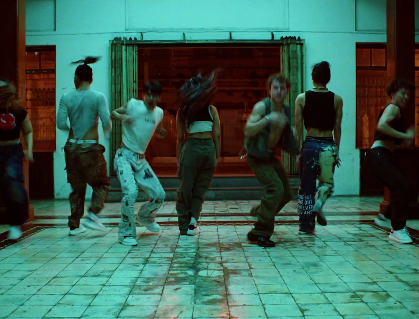 a group of young people dancing in a dance studio