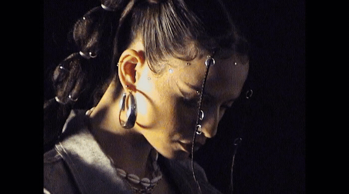 a close up of a person with ear rings