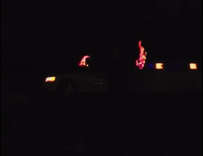 a blurry photo of a car in the dark