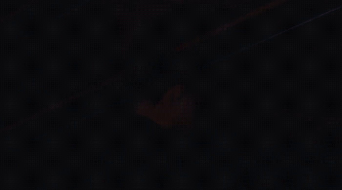 a blurry photo of a person in the dark