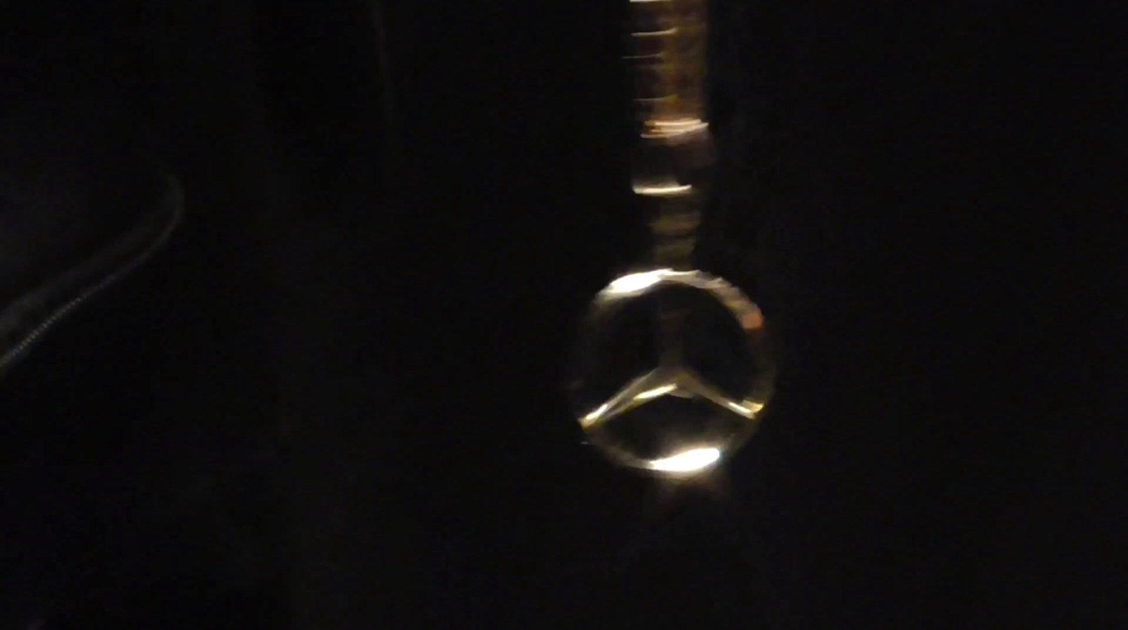 a close up of a metal object in the dark