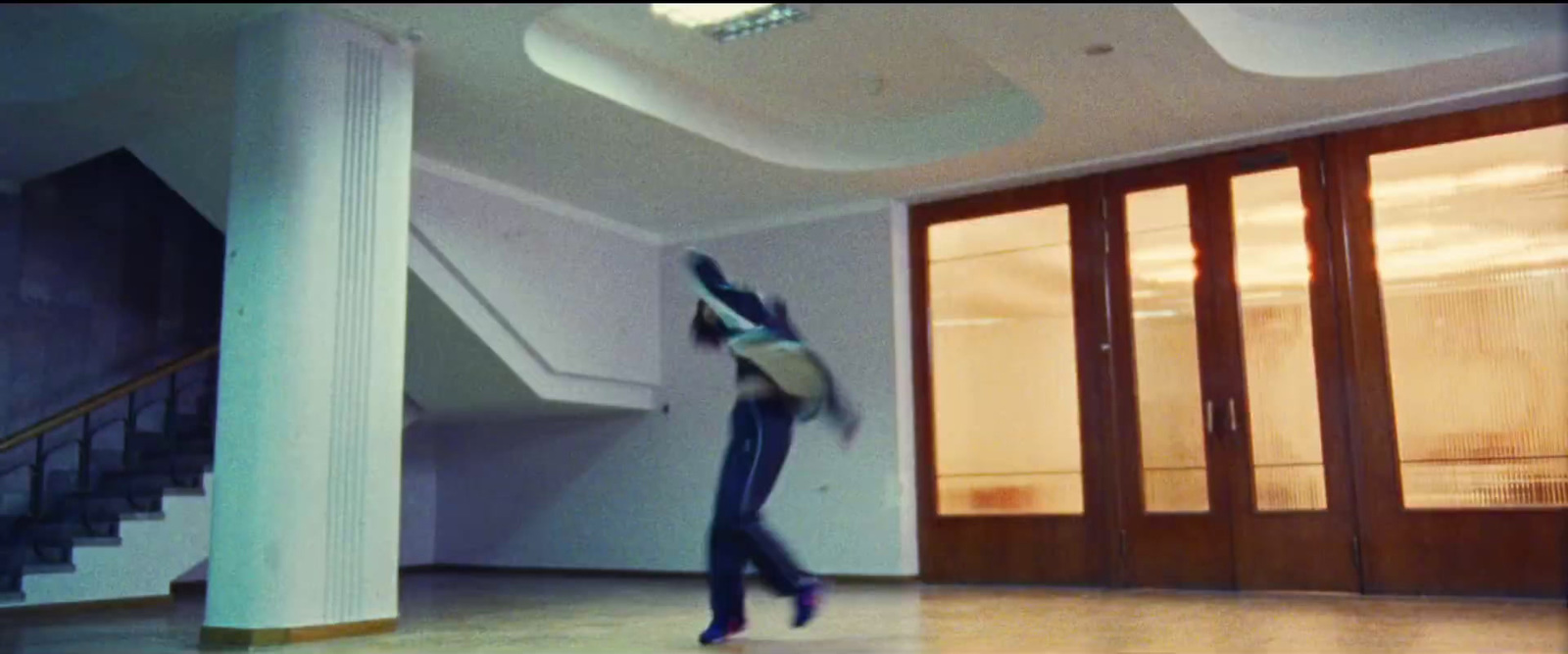 a person jumping in the air in a room