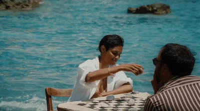 a man and a woman playing a game of chess