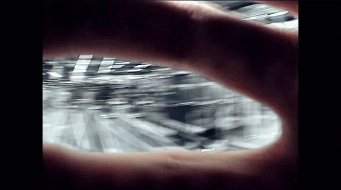 a blurry photo of a person's hand holding something
