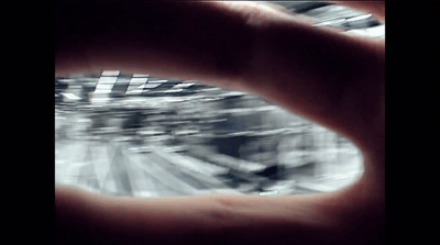 a blurry photo of a person's hand holding something