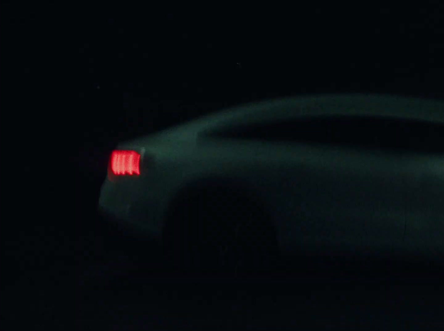 a car that is sitting in the dark