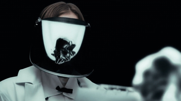 a woman in a white coat and a black and white mask