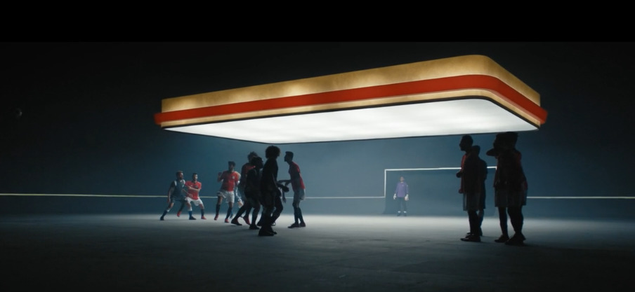 a group of people standing around a gas station