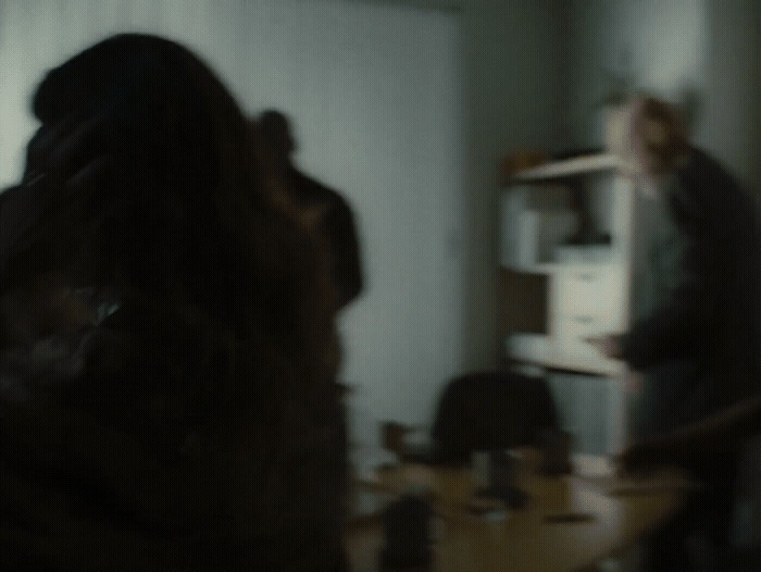 a blurry photo of two people in a room