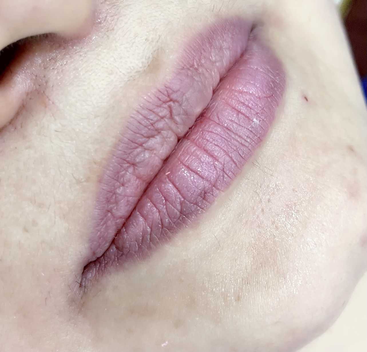 a close up of a person's lips and nose