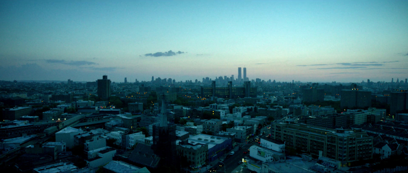 a view of a city at dusk from a tall building