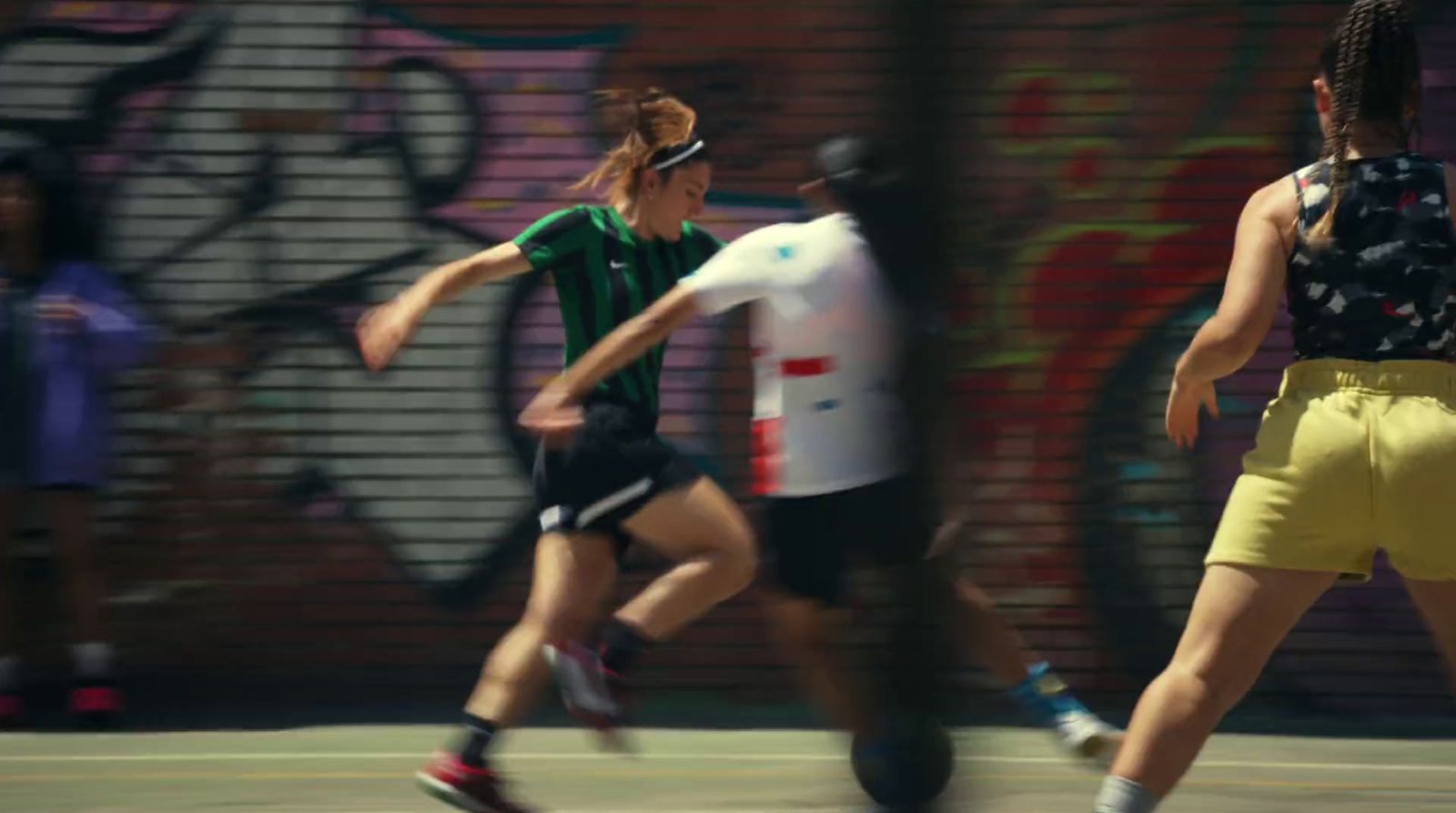 a group of people playing a game of tennis