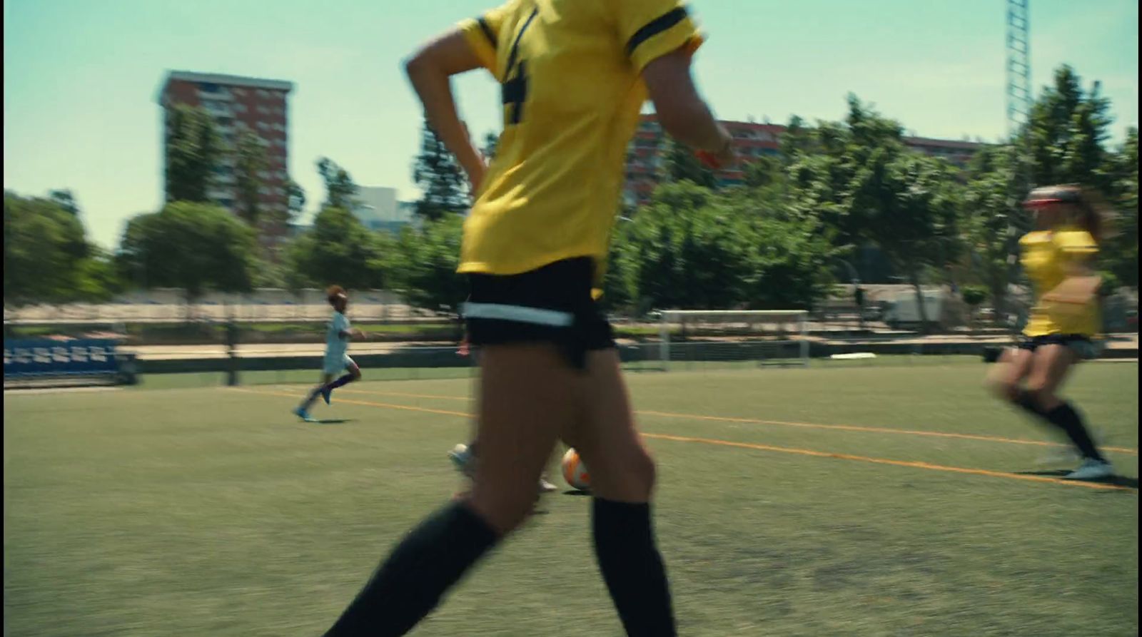 a group of people playing a game of soccer