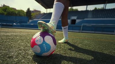 a person standing on top of a soccer ball