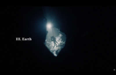 a person standing under a street light in the dark