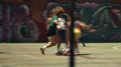 a group of people playing a game of basketball