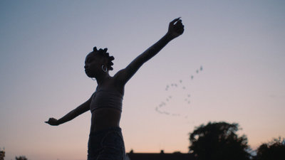 a man is throwing a frisbee in the air