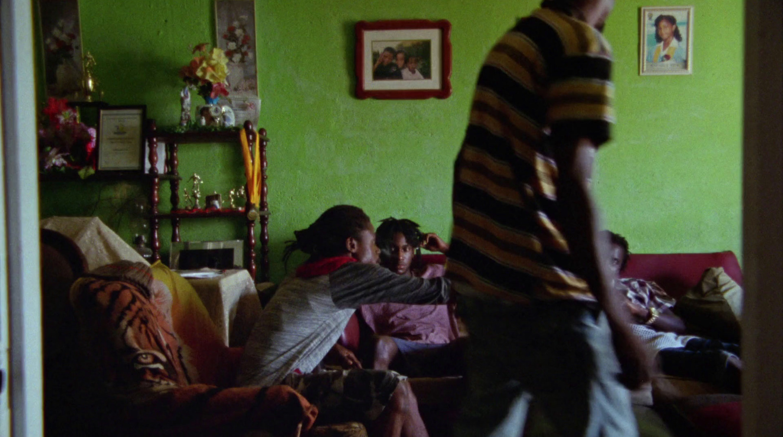 a group of people sitting on a couch in a living room