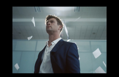 a man in a suit and white shirt looking up