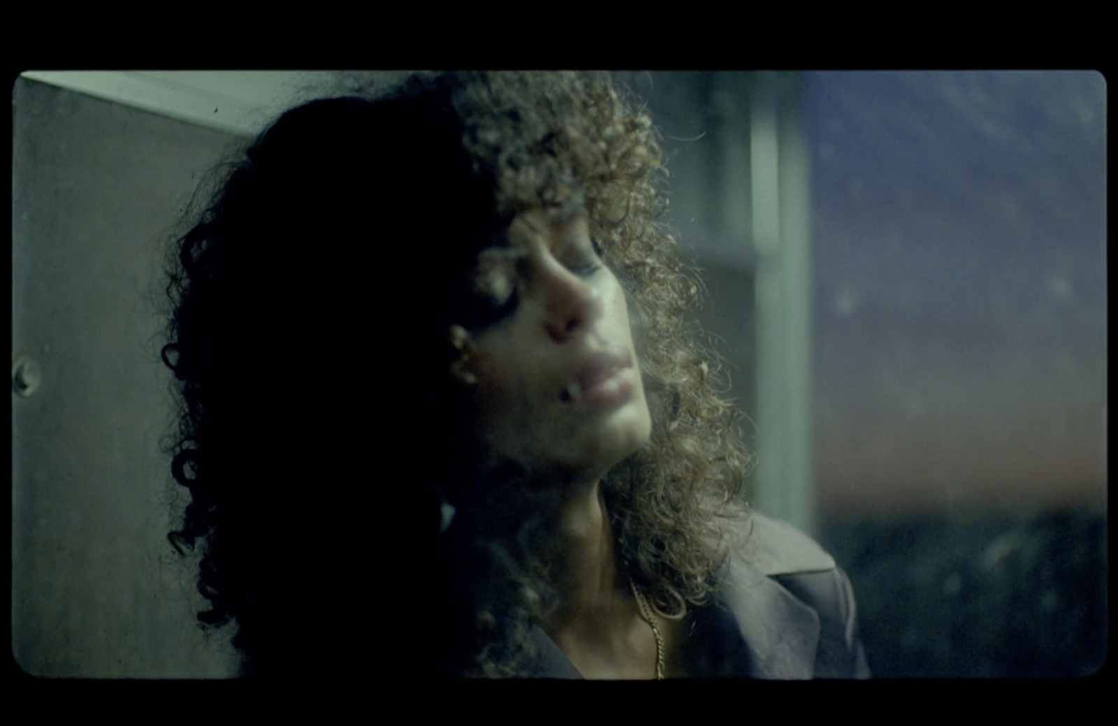 a close up of a person with curly hair