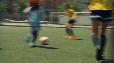 a blurry photo of a soccer game being played