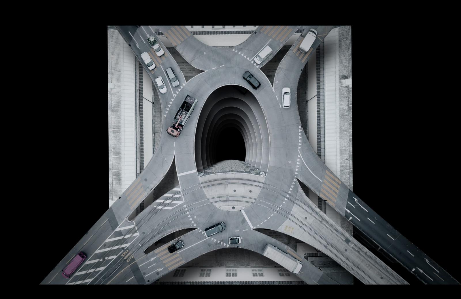 an aerial view of a highway intersection with cars