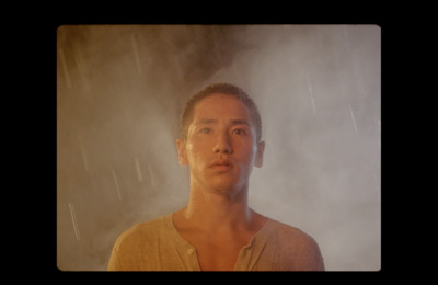 a man standing in front of a shower of water