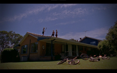 a couple of people standing on top of a roof