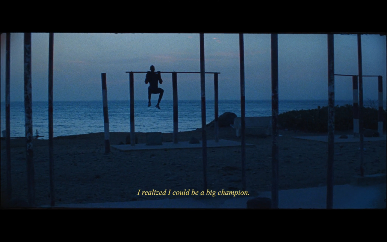 a person standing on a beach next to the ocean