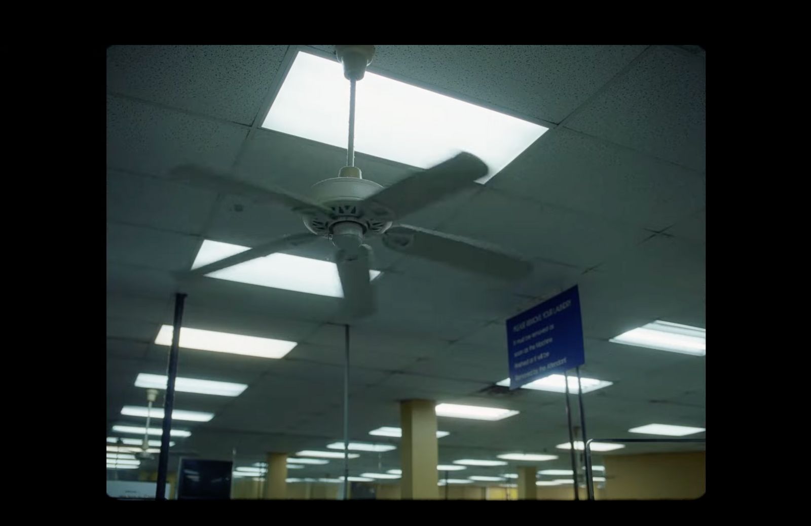 a ceiling fan in an empty building