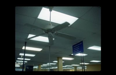 a ceiling fan in an empty building