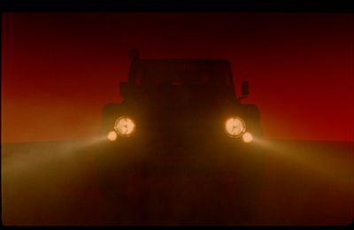 the headlights of a truck in the fog