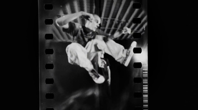 a black and white photo of a person doing a trick on a skateboard