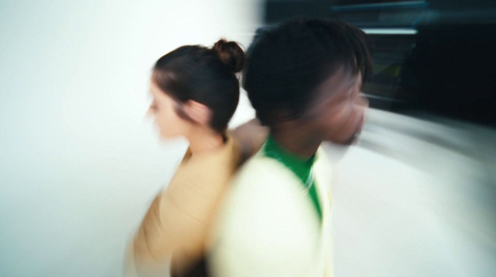 a blurry photo of two people walking together