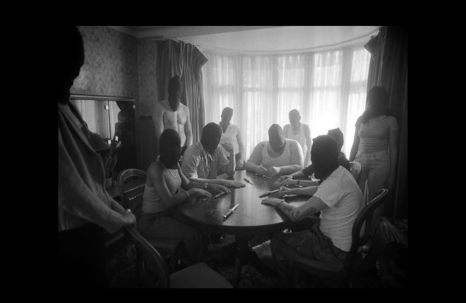 a group of people sitting around a table