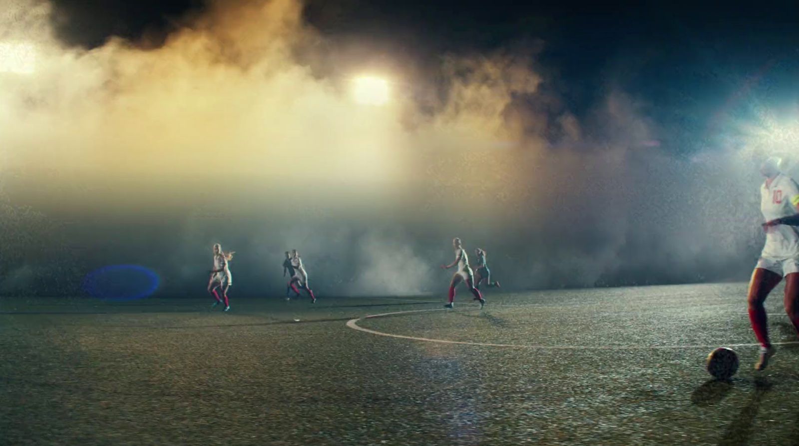 a group of women playing soccer on a field