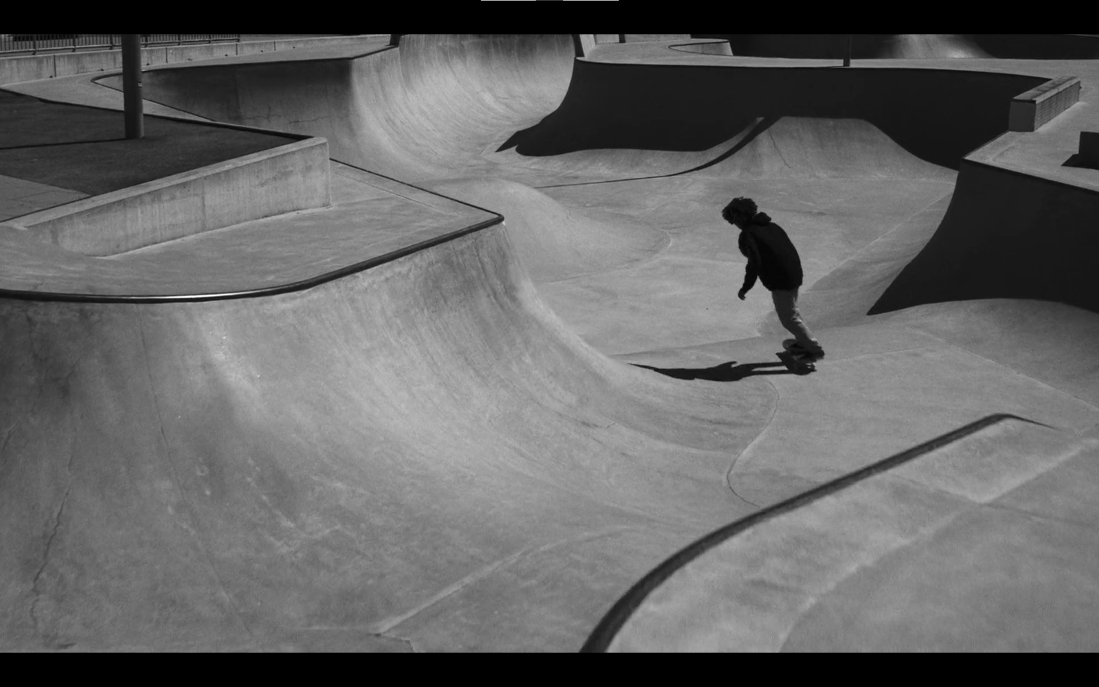 a man riding a skateboard up the side of a ramp