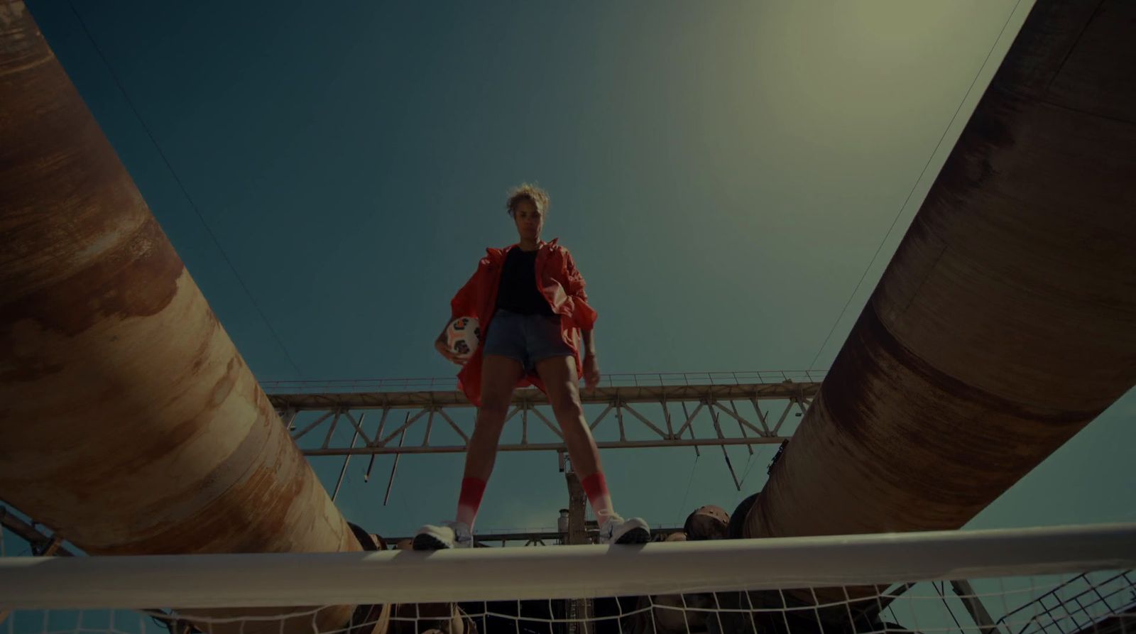 a woman standing on top of a volleyball court