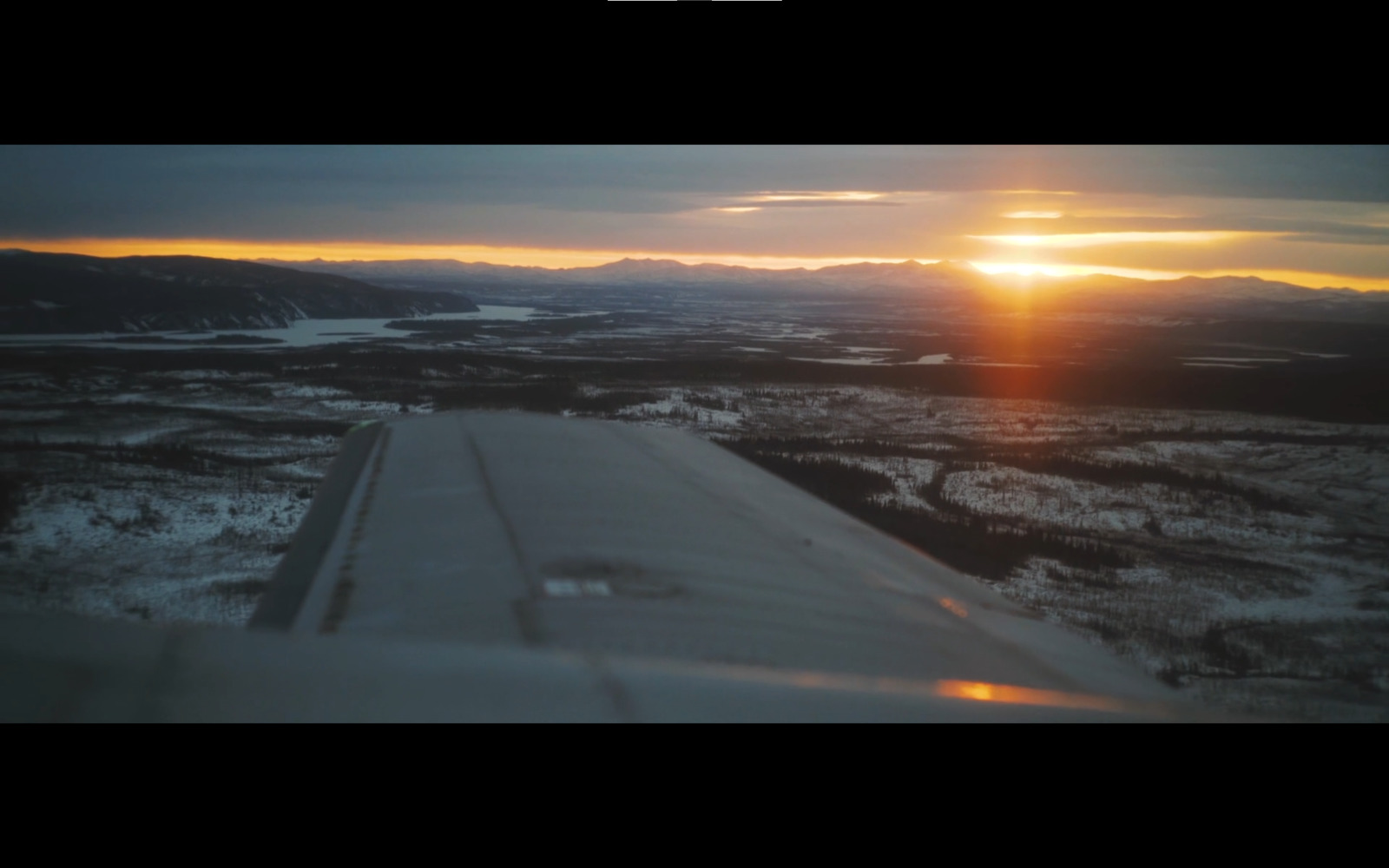 a view of a sunset from an airplane window