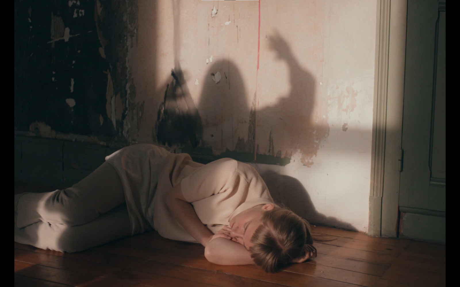 a woman laying on the floor in a room